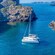 A catamaran floating on the Mediterranean Sea near Santorini, Greece